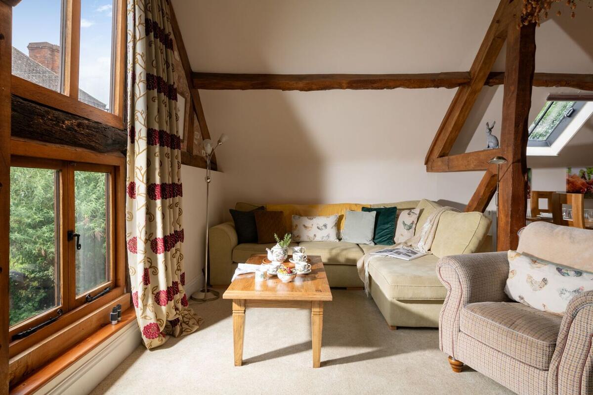 Lounge with cream sofas and tall windows