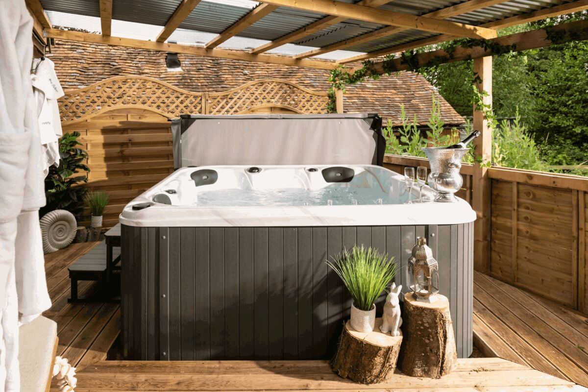 Hot tub under a covered wooden deck
