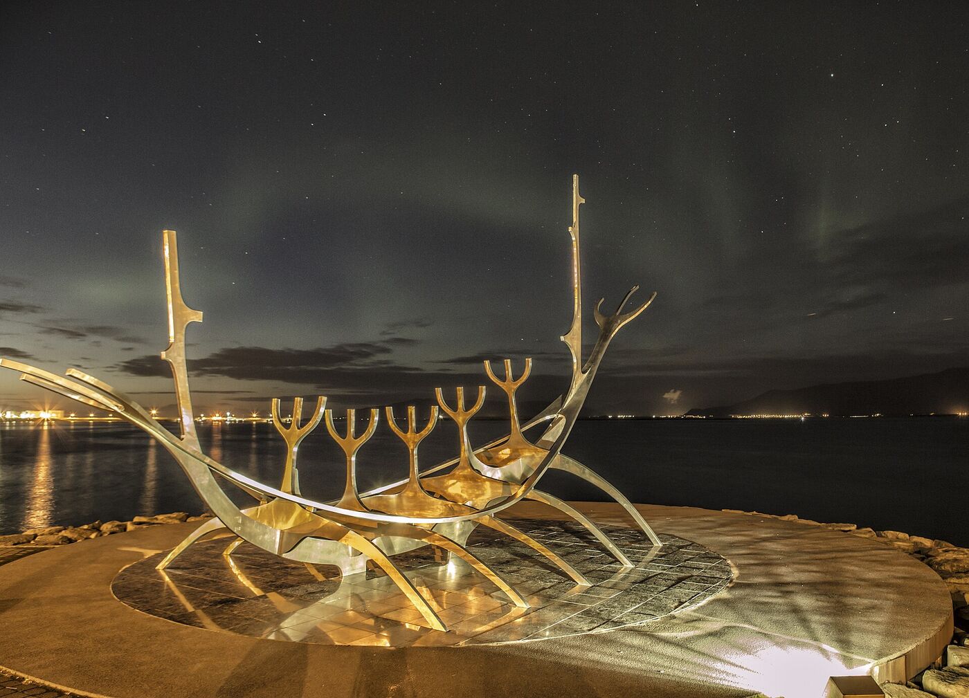 The aurora over the Sun Voyager sculpture on the Reykjavík seafront